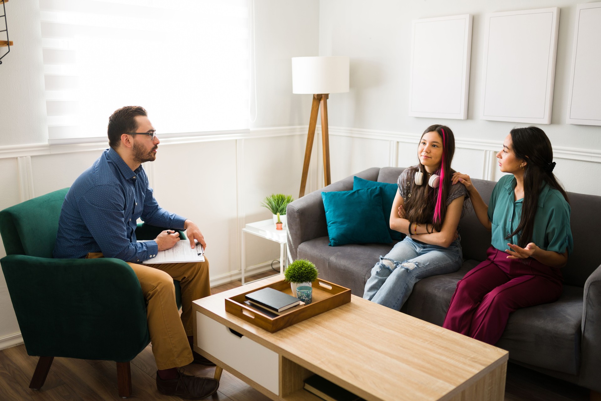 Therapist listening to the emotional problems of a teen